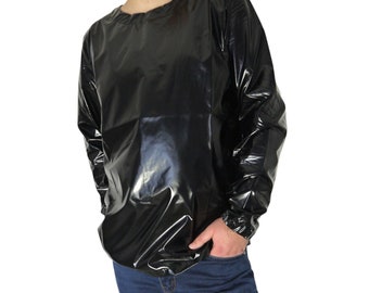 May include: A black long-sleeved shirt made of shiny, waterproof material. The shirt has a round neckline and elastic cuffs.