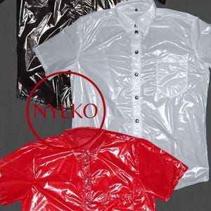 May include: Three short-sleeved button-down shirts in black, white, and red. The shirts have a shiny, plastic-like appearance. The image includes the text "NYLKO" in a red circle.