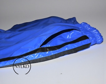 May include: Bright blue athletic shorts with black trim and a pocket opening. The shorts have a shiny, waterproof appearance. The brand logo "NYLKO" is visible in a circular design.