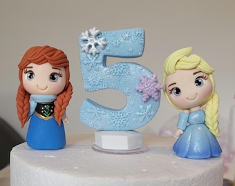 Inspired Elsa and Anna Cake Topper Set with Candle |  Inedible and Handcrafted with Eco-Friendly, Plastic-Free, Non-Toxic Cold Porcelain