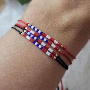 USA Patriotic Bracelet. 250th Anniversary. 4th of July. Flag colors: red, blue, white, gold. Beaded USA flag. American beaded bracelet stack