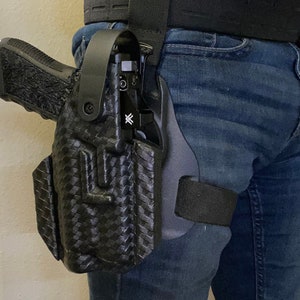 Level ll drop leg duty holster w/ hood for most popular LE duty sized pistols and weapon mounted lights (see photo section for all options)