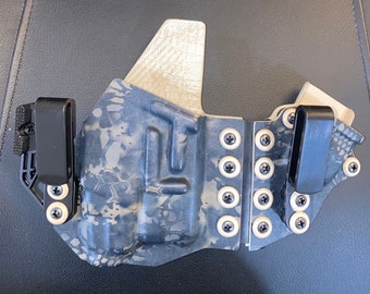 Glock 26, 27, 33 w/TLR7sub on recover rail Appendix Sidecar style holster, shown Kryptek Xtreme Obskura Nox Camo & Desert Tan Carbon Fiber