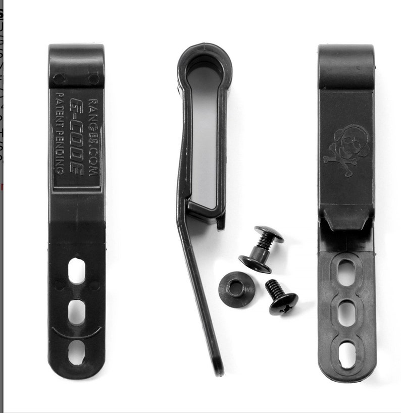 May include: Black plastic belt clip with a skull and crossbones design. The clip has four holes for attaching to a belt. The clip is accompanied by two black screws and a washer.
