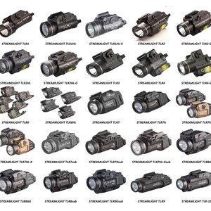 May include: A collection of 20 Streamlight TLR series tactical weapon lights. The lights are black and tan in color and feature a variety of different designs and features. The lights are arranged in rows of five, with each light labeled with its model number.
