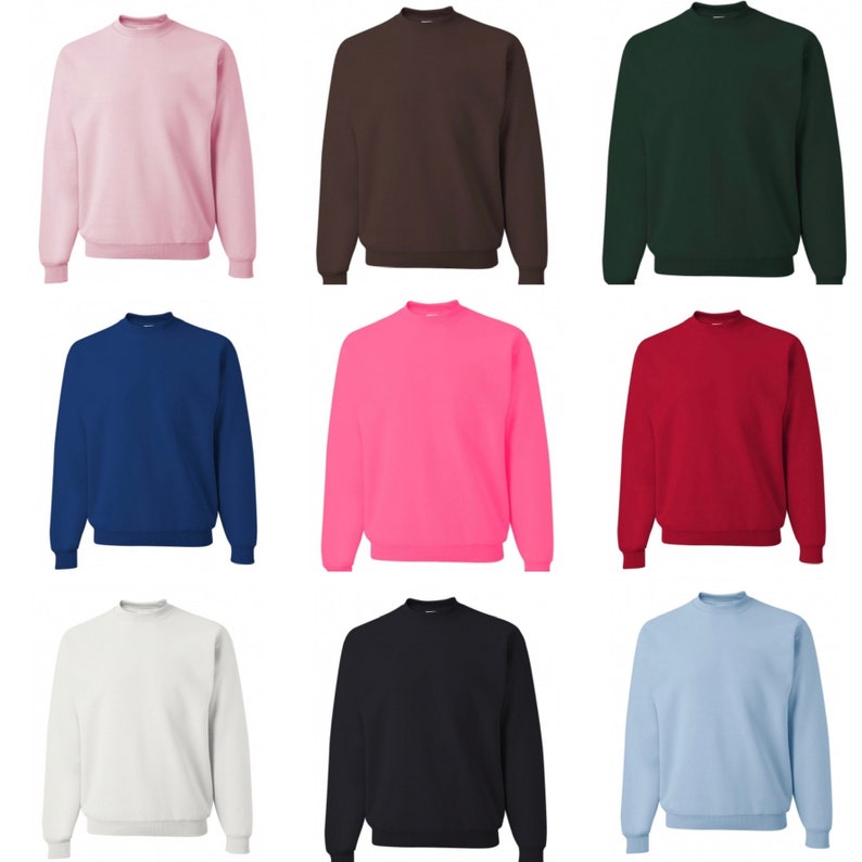 May include: Nine crew neck sweatshirts in a variety of colours, including pink, brown, green, blue, neon pink, red, white, black, and light blue.