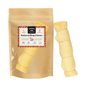 May include: A brown paper bag with a clear plastic window showing a beige dog chew. The bag has a label with the text "Tiger's Natural Treats" and "Natural Dog Chews". The label also has a tiger illustration and the text "Single Ingredient", "Zero Preservatives", "Wild on Flavors", and "Gentle on Tummies".