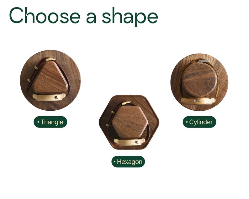 three different shapes of wooden objects, each with a unique design and color.