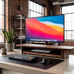 a modern workspace with a large flat-screen monitor, a wooden desk, a keyboard, a mouse, and a potted plant.