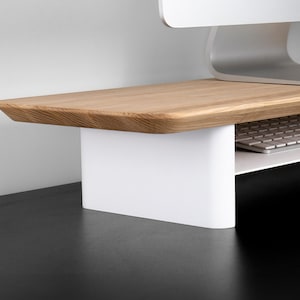 a computer desk with a keyboard and mouse