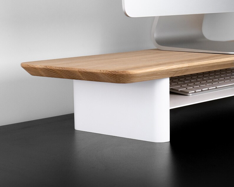 a computer desk with a keyboard and mouse