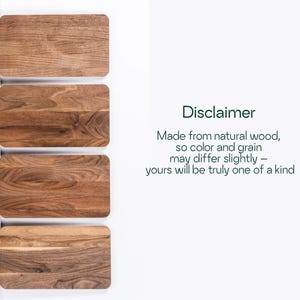 four wooden cutting boards, each with a different color and grain pattern, arranged side by side.
