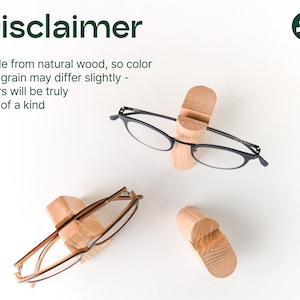 a pair of glasses sitting on top of a table