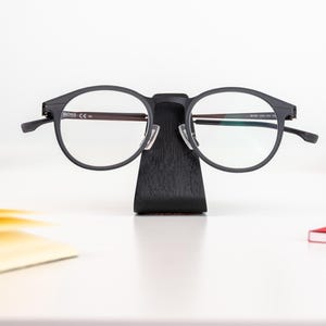 a pair of glasses sitting on top of a table
