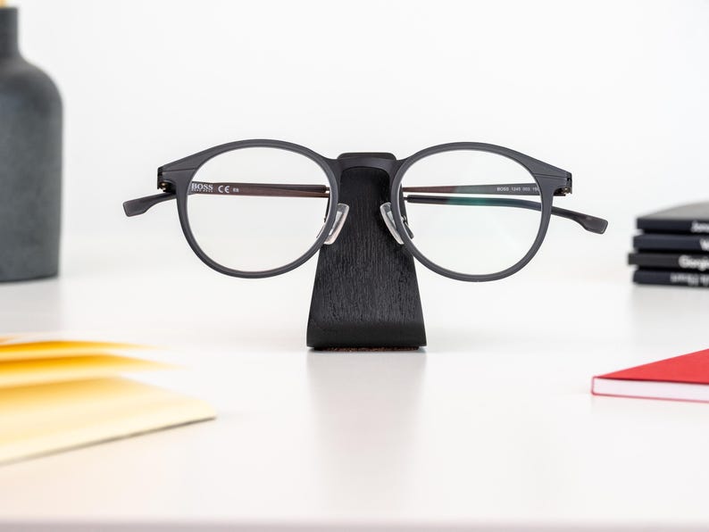 a pair of glasses sitting on top of a table