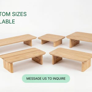 a collection of six wooden tables or benches, each with a different size and shape, arranged in a circular pattern. The text "CUSTOM SIZES AVAILABLE" is displayed above the arrangement, indicating that these tables can be customized in size. At the bottom of the image, there is a message that reads "MESSAGE US TO INQUIRE", suggesting that the image is part of a larger collection and that viewers can reach out to inquire about the available sizes.