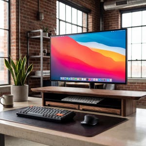 a modern workspace with a large flat-screen monitor, a wooden desk, a keyboard, a mouse, and a potted plant.