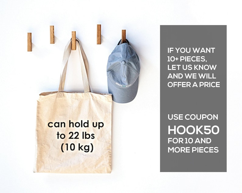 a beige tote bag and a blue baseball cap hanging on hooks, along with text promoting a sale.