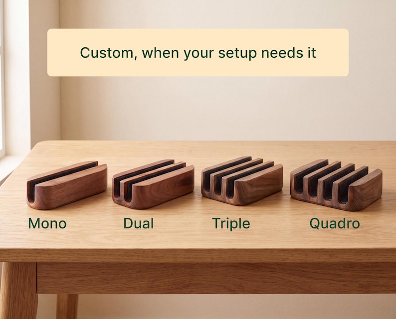 four wooden charging docks of different types, labeled as "Mono", "Dual", "Triple", and "Quadro", arranged on a wooden table.
