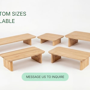 a collection of six wooden tables or benches, each with a different size and shape, arranged in a circular pattern. The text "CUSTOM SIZES AVAILABLE" is displayed above the arrangement, indicating that these tables can be customized in size. At the bottom of the image, there is a message that reads "MESSAGE US TO INQUIRE", suggesting that the image is part of a larger collection and that viewers can reach out to inquire about the available sizes.