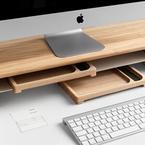 a computer desk with a keyboard and mouse