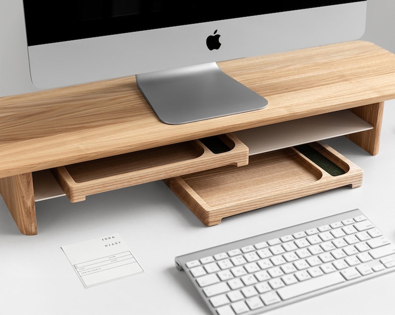 a computer desk with a keyboard and mouse