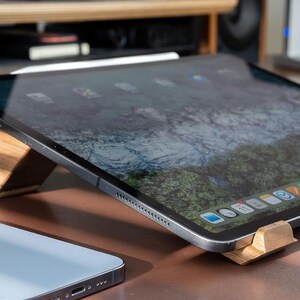 a tablet sitting on top of a wooden table