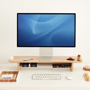 a computer monitor sitting on top of a white desk