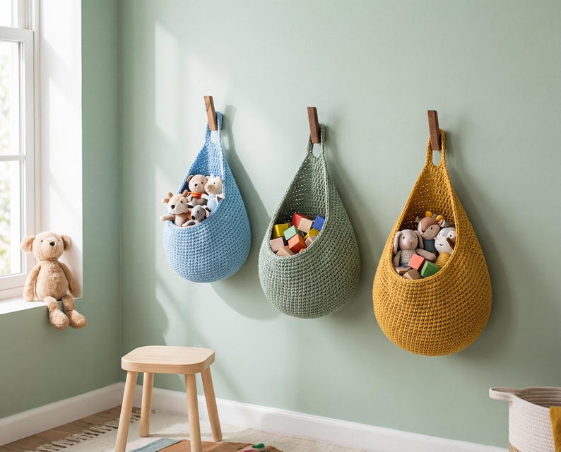 A cozy children's room with a window, three hanging baskets filled with toys, and a wooden stool.