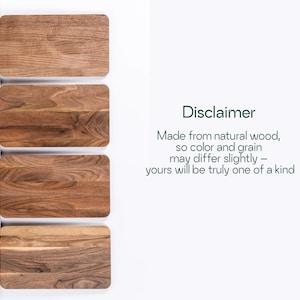 four wooden cutting boards, each with a different color and grain pattern, arranged side by side.