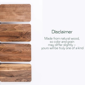 four wooden cutting boards, each with a different color and grain pattern, arranged side by side.