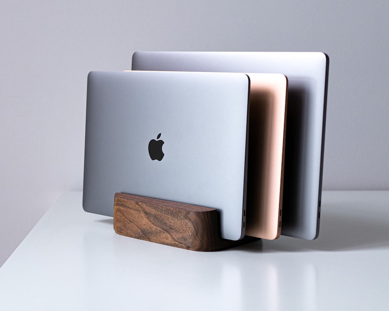 a couple of laptops sitting on top of a table