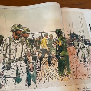 May include: A printed illustration on a book page depicting soldiers in green uniforms and helmets walking through tall grass. A helicopter is visible in the background, and a figure in a yellow jacket stands among the group. Text reads VIET NAM.