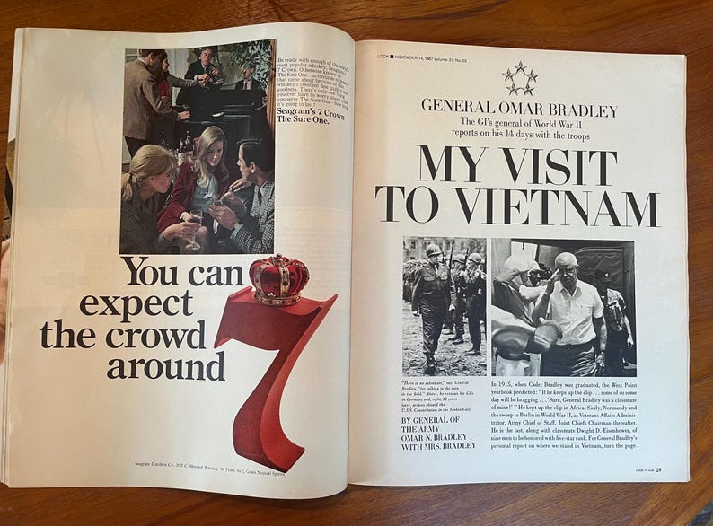 May include: A vintage magazine spread featuring a Seagram's 7 Crown advertisement on the left with a large red number seven topped by a crown, and an article on the right titled General Omar Bradley My Visit to Vietnam with black and white photos.
