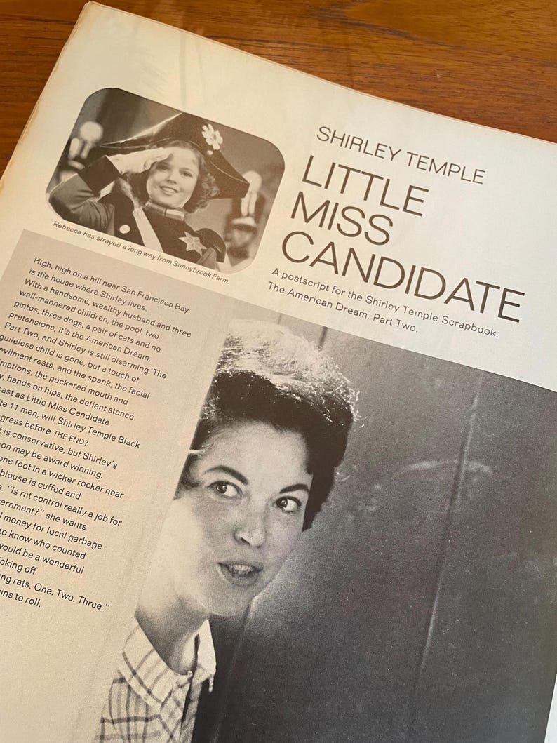 May include: A vintage magazine page titled Shirley Temple Little Miss Candidate featuring a black and white photograph of Shirley Temple in a military-style hat saluting, alongside a portrait of a woman and several columns of printed text.