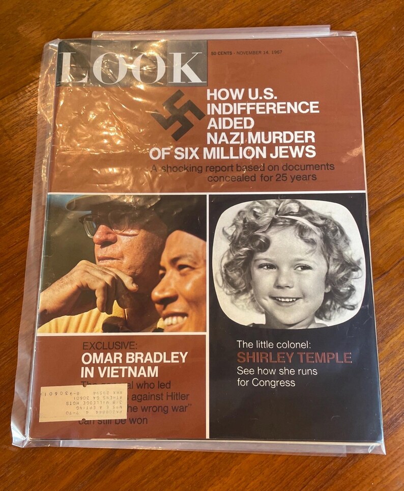 May include: A November 14, 1967 issue of Look magazine featuring a brown cover with the title LOOK, a swastika, and text about Nazi history. It includes a photo of two men, a photo of Shirley Temple, and text about Omar Bradley in Vietnam.