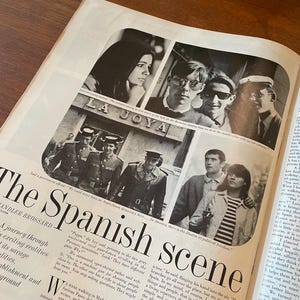 May include: A vintage magazine page titled The Spanish scene by Chandler Brossard, featuring black and white photographs of people and uniformed officials in Spain. The layout includes columns of printed text and multiple candid images.