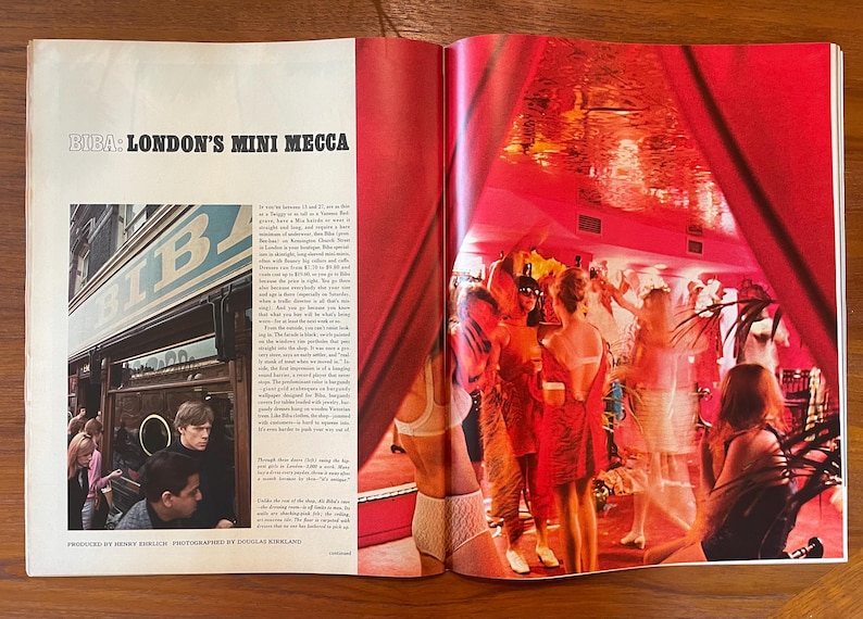 May include: A vintage magazine spread titled BIBA: LONDON'S MINI MECCA. The left page features a black and white photograph of the Biba storefront. The right page displays a vibrant, red-toned photograph of people in a crowded, dimly lit interior.