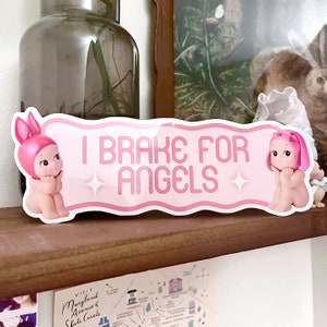i brake for angels bumper sticker | cute bumper sticker, coquette bumper sticker, car sticker, sonny angels