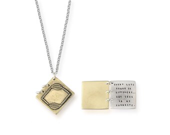 May include: A silver chain necklace with a gold-toned pendant that opens to reveal a message that reads "Every love story is different... but ours is my favorite."