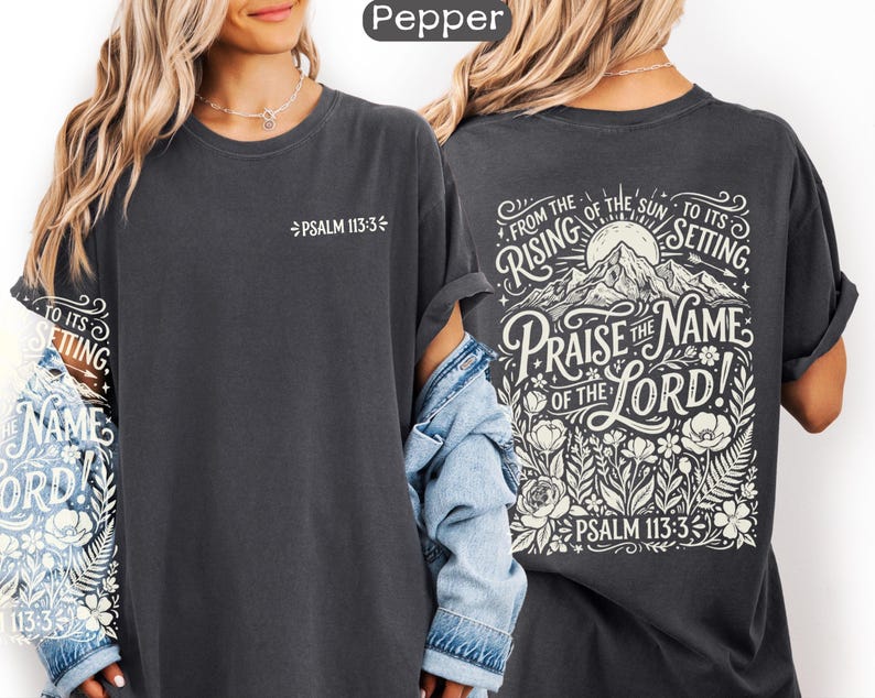 May include: Dark gray t-shirt with the text "Psalm 113:3" on the front. The back of the shirt features a mountain scene with the words "Praise the Name of the Lord!" and "From the rising of the sun to its setting."