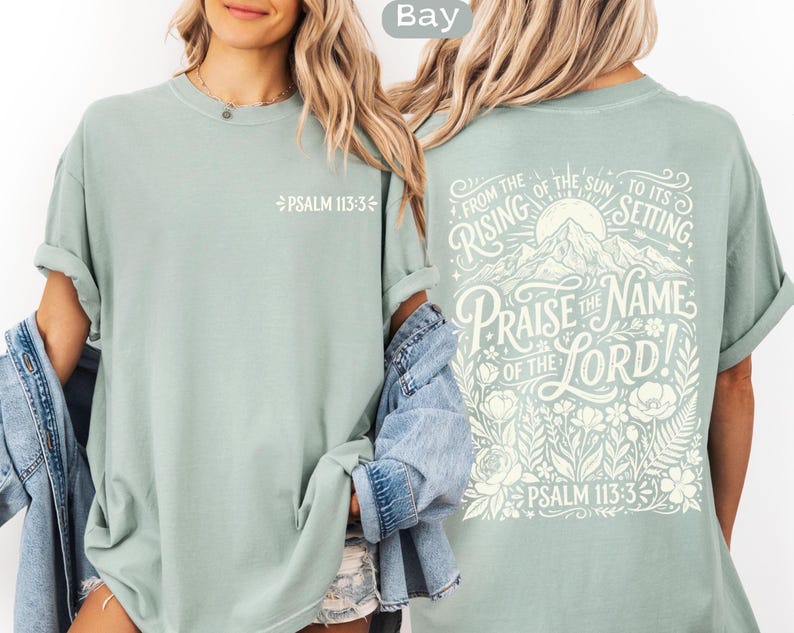 May include: A light green t-shirt with the text "PSALM 113:3" on the front. The back of the shirt features a mountain and floral design with the words "PRAISE THE NAME OF THE LORD!" and "PSALM 113:3".