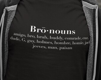 May include: Black t-shirt with white text that reads "Bro-nouns" and a list of words including "amigo, bro, bruh, buddy, comrade, cuz, dude, G, guy, holmes, hombre, homie, jack, jeeves, man, paisan".
