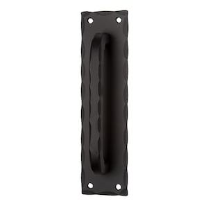 May include: Black metal door pull handle with a textured surface and rounded edges. The handle is attached to a rectangular plate with two holes for mounting.