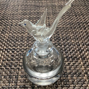 Vintage perfume bottle with bird stopper