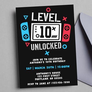 May include: Black invitation card with a gaming theme. The card reads "LEVEL 10 UNLOCKED" with a controller graphic. It includes details for Anthony's 10th birthday: date, time, address, and RSVP information. A gray envelope is partially visible.