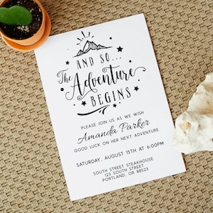 May include: A black and white invitation card with a mountain illustration and the text "The Adventure Begins". The invitation is for Amanda Parker's next adventure, which will take place on 15th August at 6:00 PM at South Street Steakhouse in Portland, Oregon.