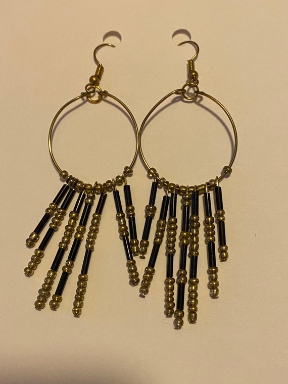 Gold and black dangle earrings