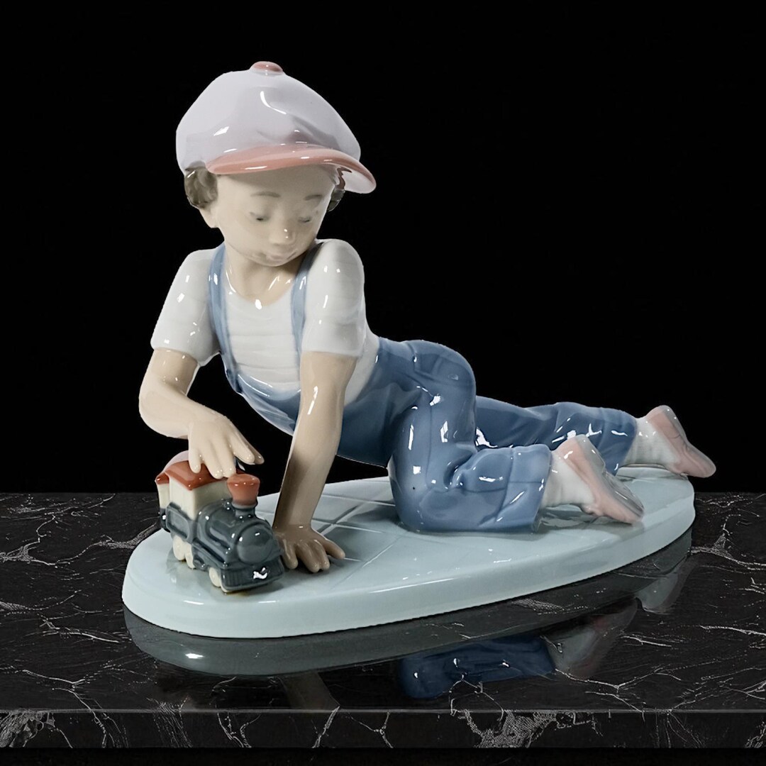 Lladro Porcelain Figurine of Boy With Toy Train ' All Aboard ' Nr