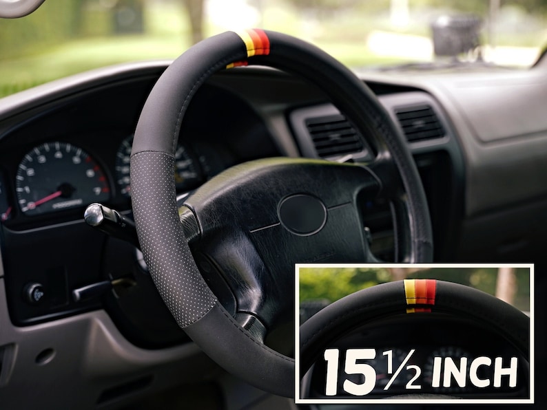 May include: Black leather steering wheel cover with red, yellow, and black stripes. The cover is 15 1/2 inches in diameter.